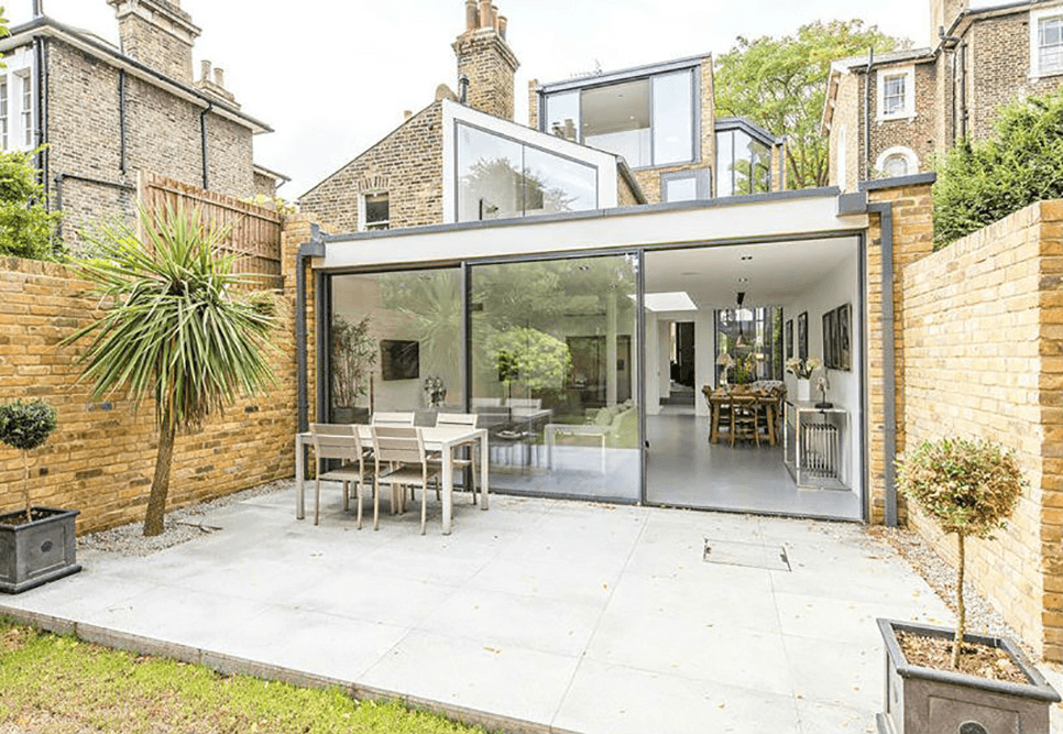 patio area with outdoor furniture and aluminium doors and windows on the house