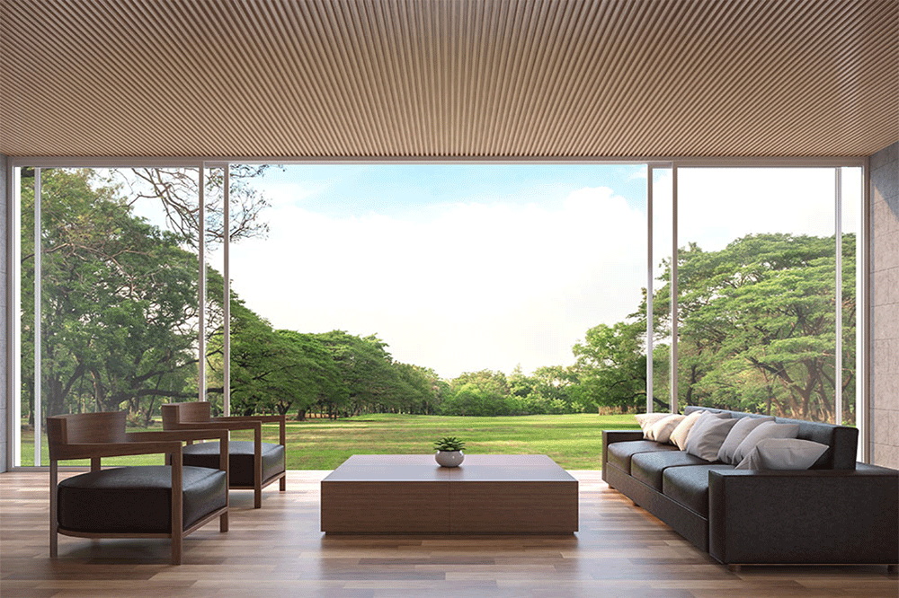 lounge area with slimline sliding doors open to lawn and trees