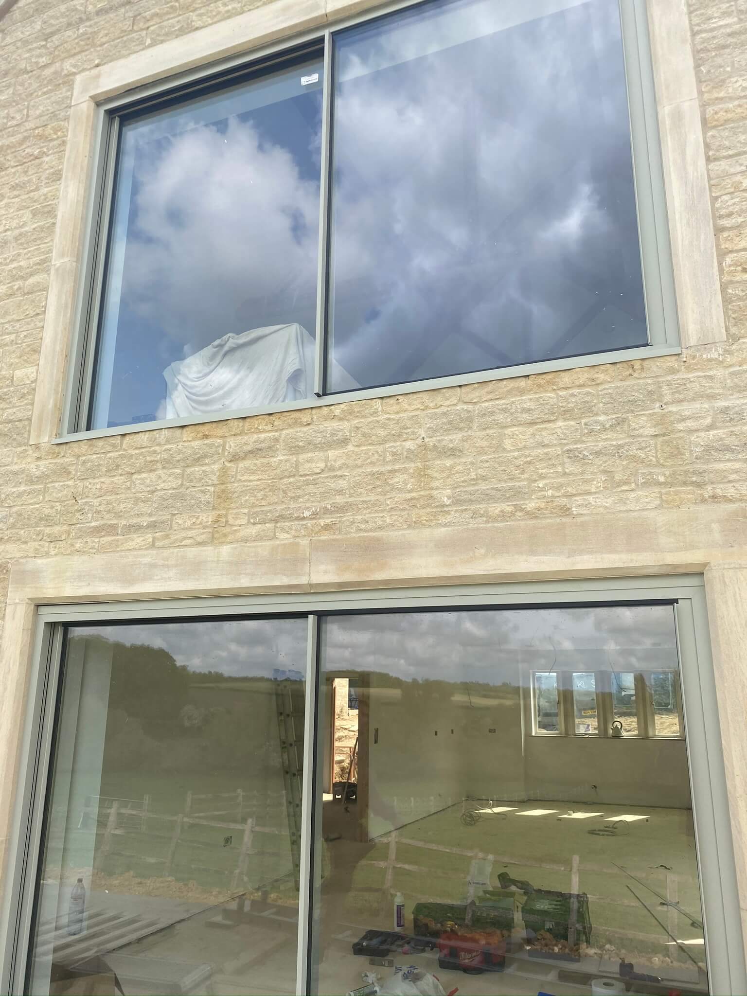 large window in natural stone house