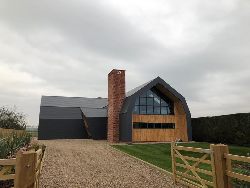 New build Dutch barn with slimline aluminium windows